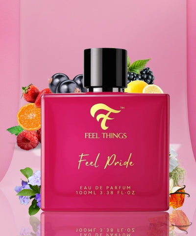 Feel Pride Women perfume bottle with fruit Ingredients and 'Feel Things' branding on a pink background