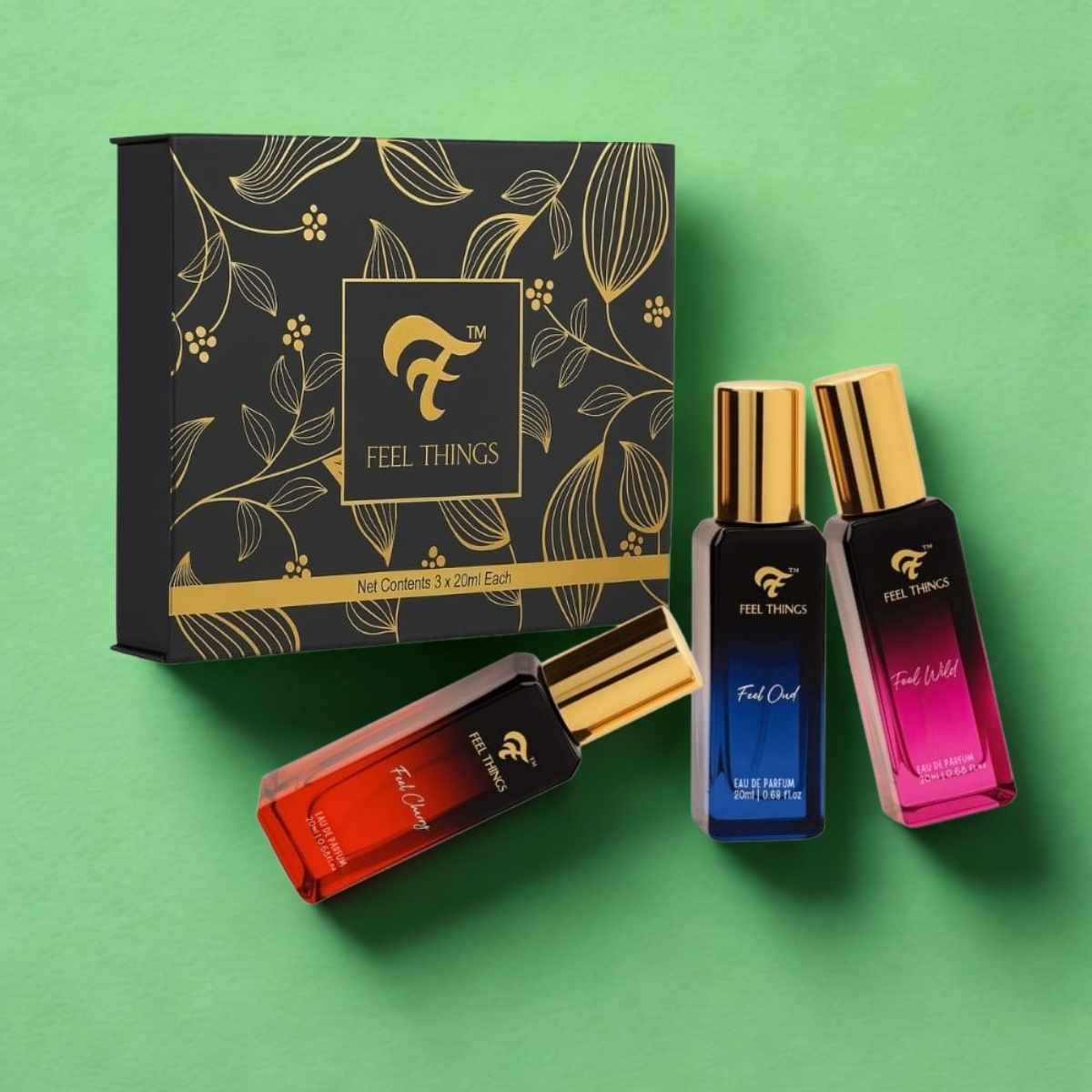 Perfume bottles and packaging with 'Feel Things' branding on a green background