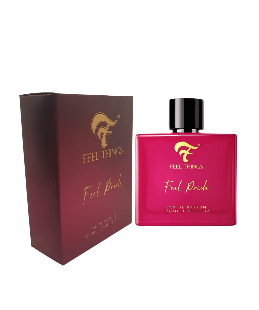 Pink perfume bottle and box with black cap and matching packaging labeled 'Feel Things Feel Pride' on a white background.