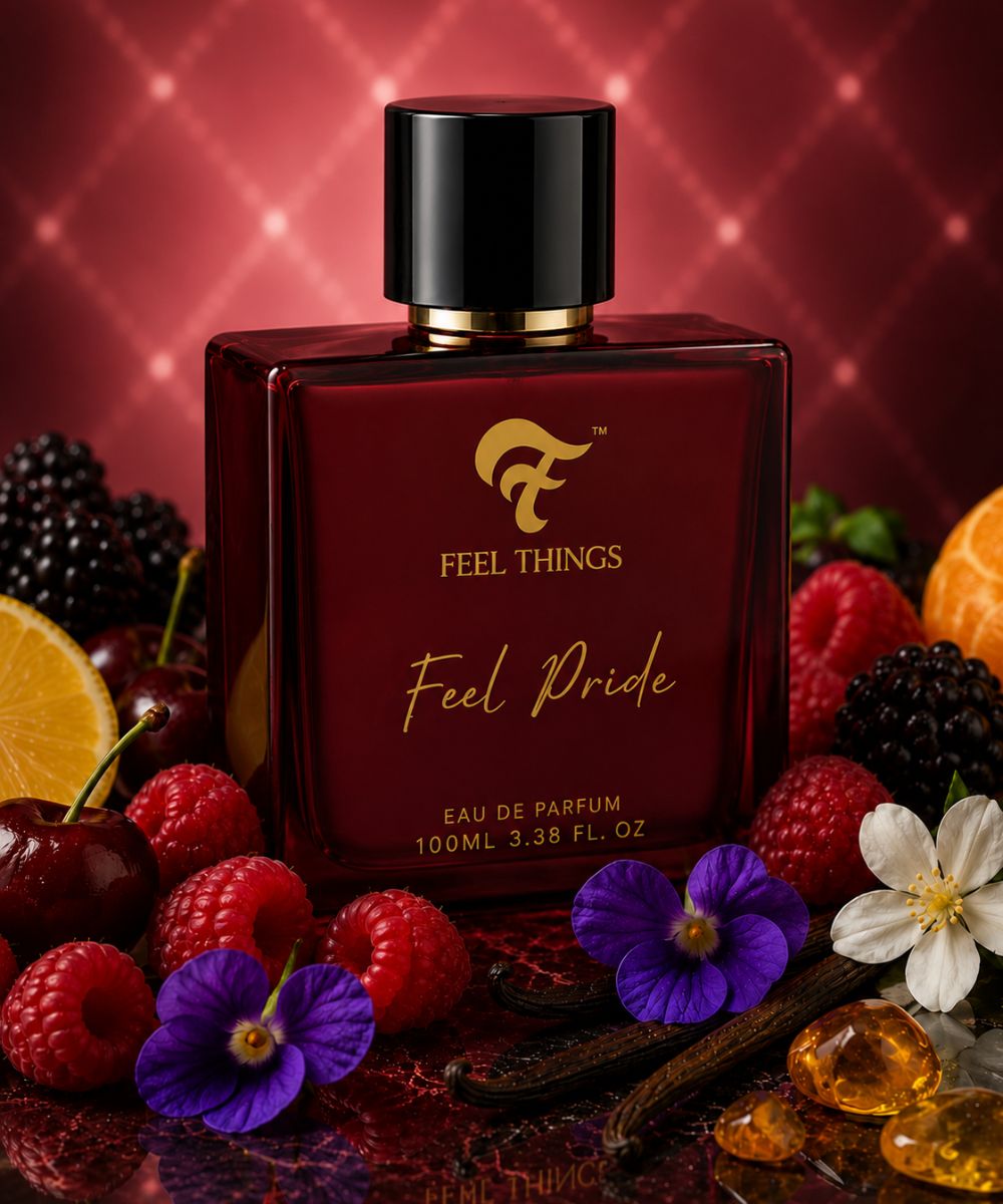 FEEL PRIDE PERFUME bottle surrounded by fruits and flowers on a red background
