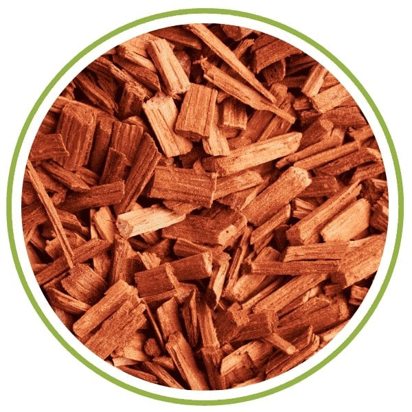 Fragrance Type woody Close-up of wood chips with a green circular border