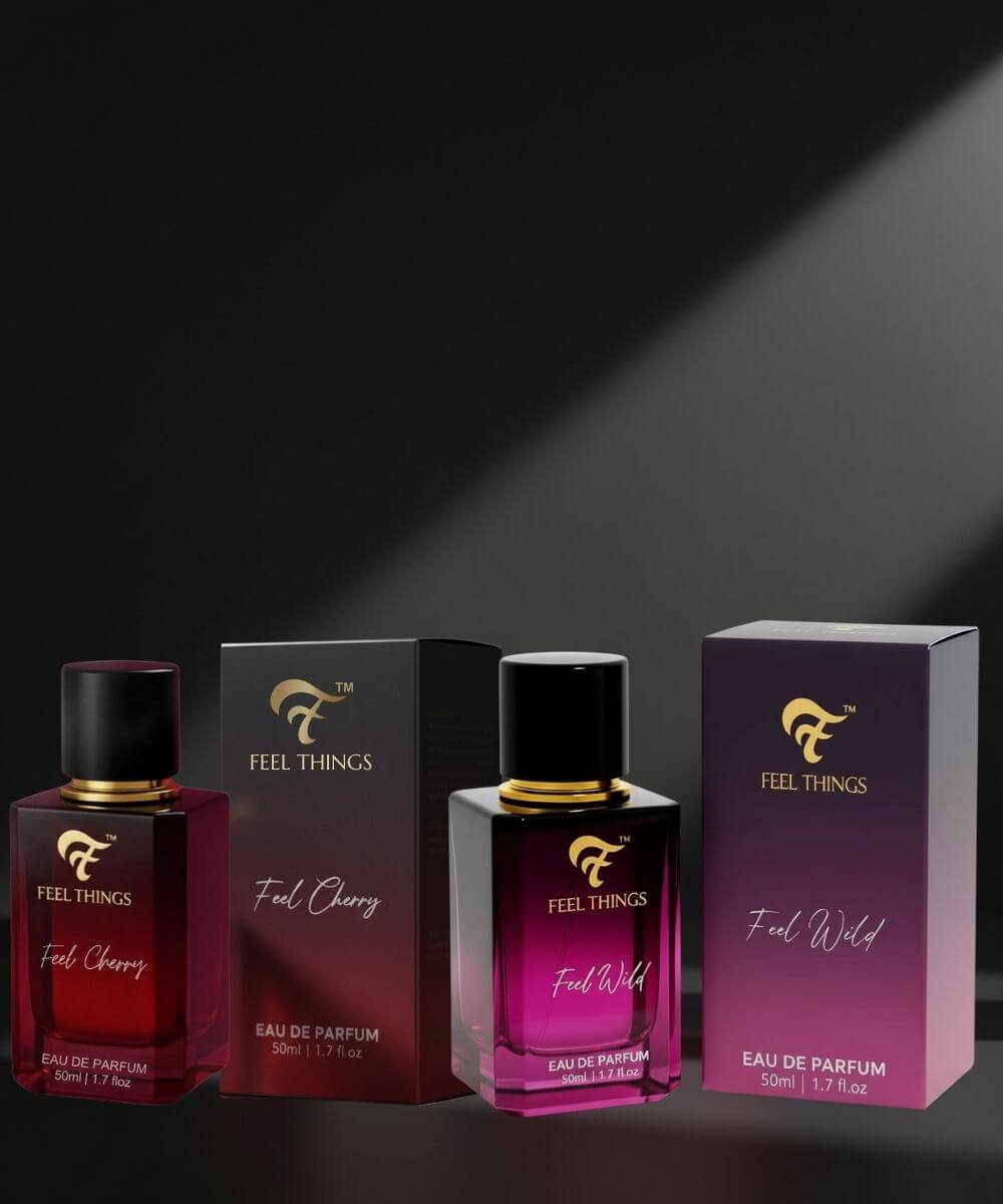 Combo bottles of 'Feel Things' perfume with their packaging on a dark background
