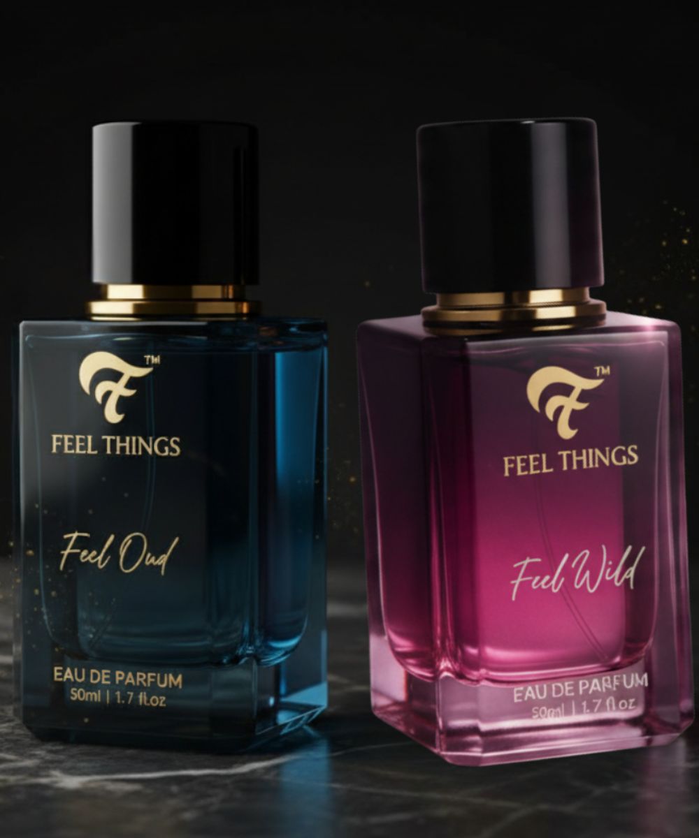 Two perfume bottles from the 'Feel Things' collection on a dark blue fabric background.