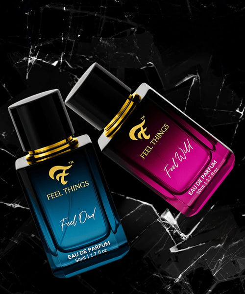 Feelthings feel oud and feel wild combo Two perfume bottles labeled 'Feel Things' on a dark cracked surfaceo 
