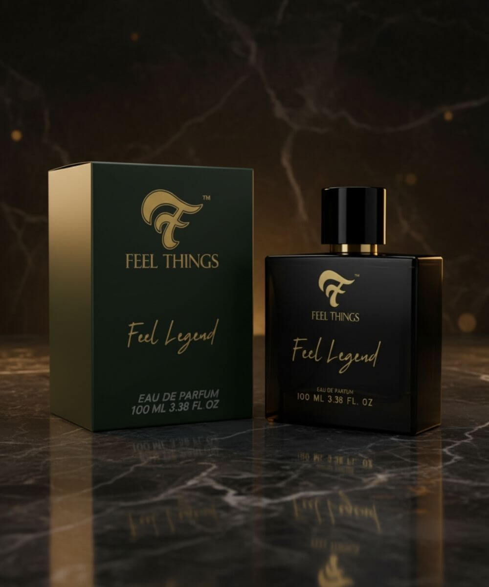 Feel Things Feel Legend perfume bottle and packaging on a dark marble surface with a dark background.