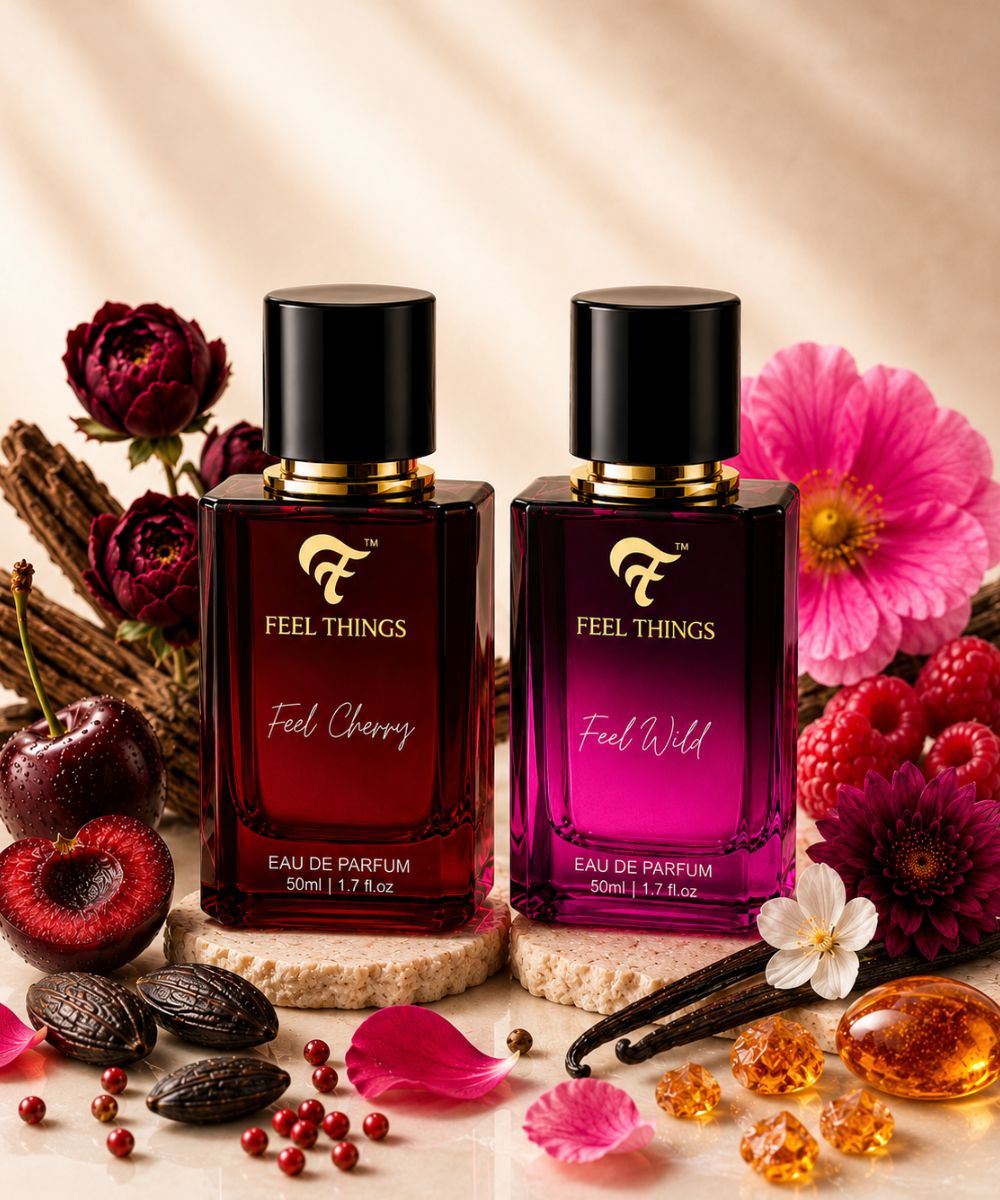 Ccombo perfume set bottles labeled 'Feel Cherry' and 'Feel Wild' surrounded by flowers and fruits on a beige background.
