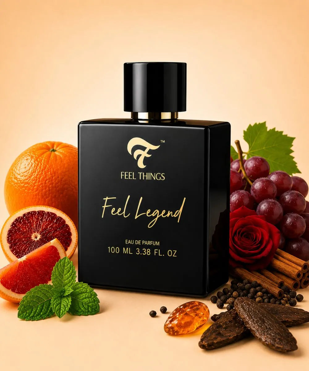   FEEL LEGEND PERFUME for men    'FEEL THINGS" with gold lettering, styled on a warm beige background with citrus, grapes, rose, mint, cinnamon, peppercorns, and amber beads around it.