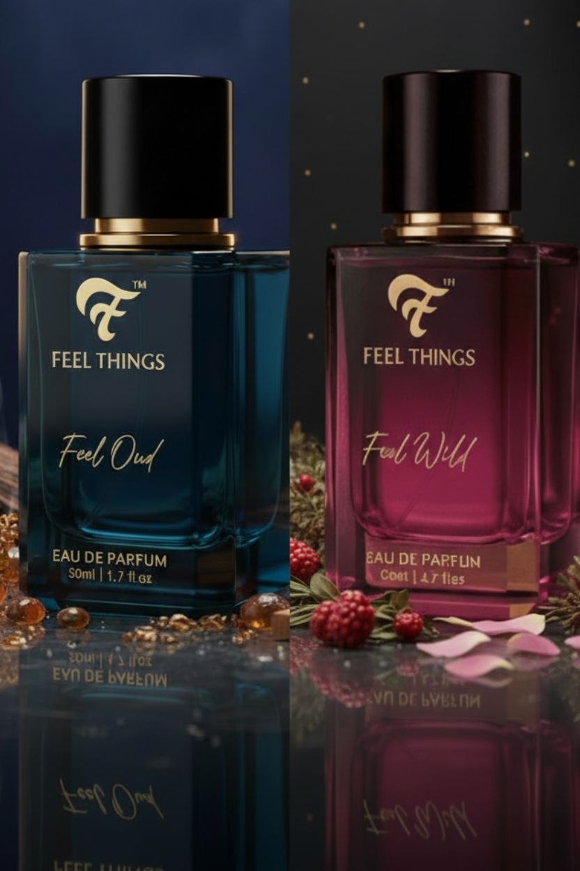 Two bottles of 'Feel Things' Eau de Parfum, one blue and one pink, on a reflective surface with decorative elements.